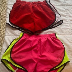 2 pairs of medium Nike running shorts